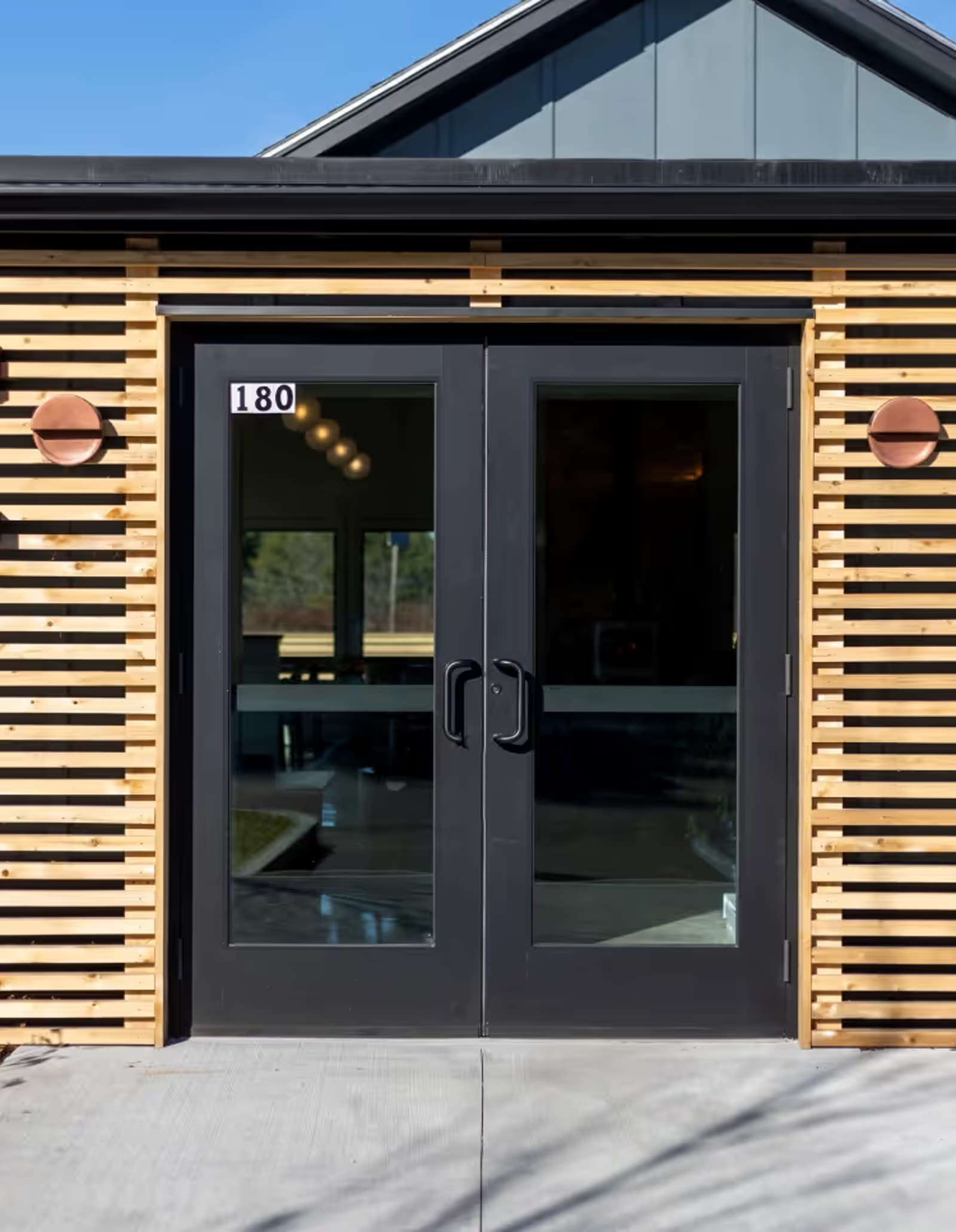 Slatted wood entry detail at Goodfire Brewing