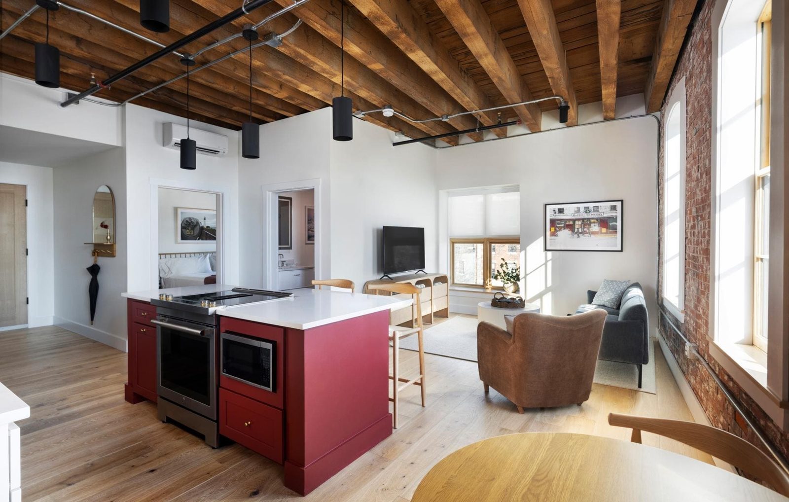 Wide view across an Evalina Hotel suite toward the living area