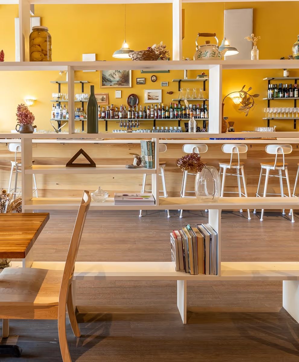 Open shelving and dining room at Leeward restaurant