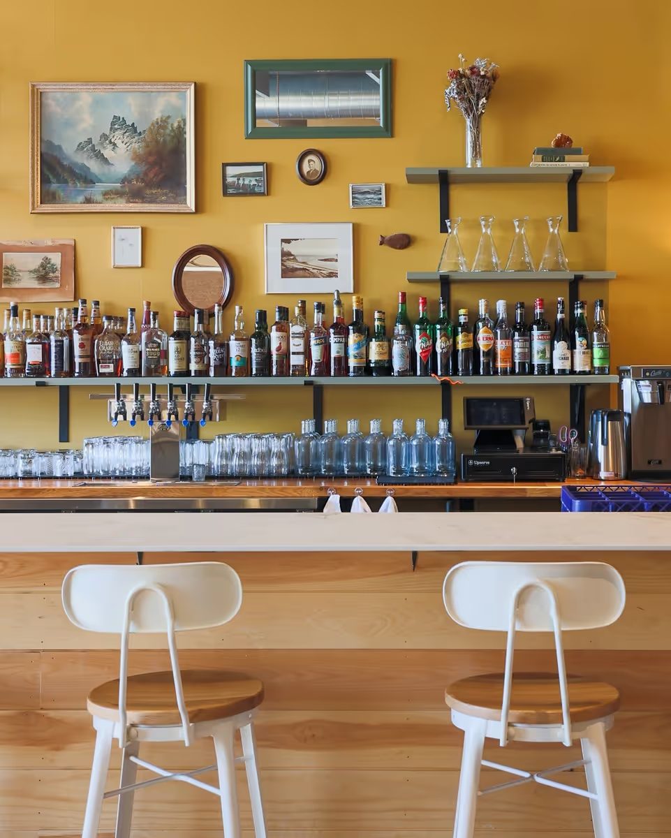 Leeward bar with backlit shelving and bar seating