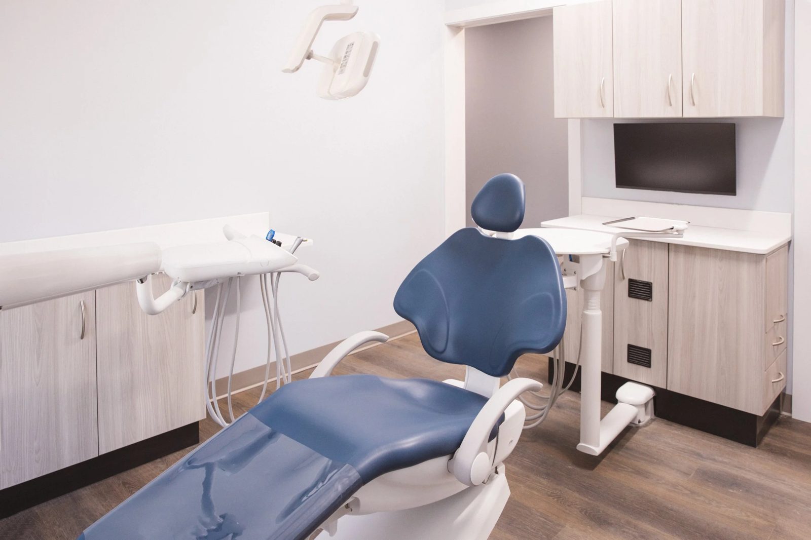 Treatment room with cabinetry and dental chair