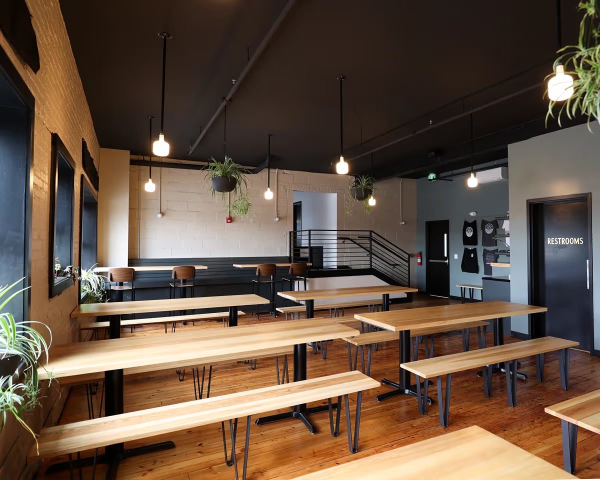 Upper level dining hall with long communal benches