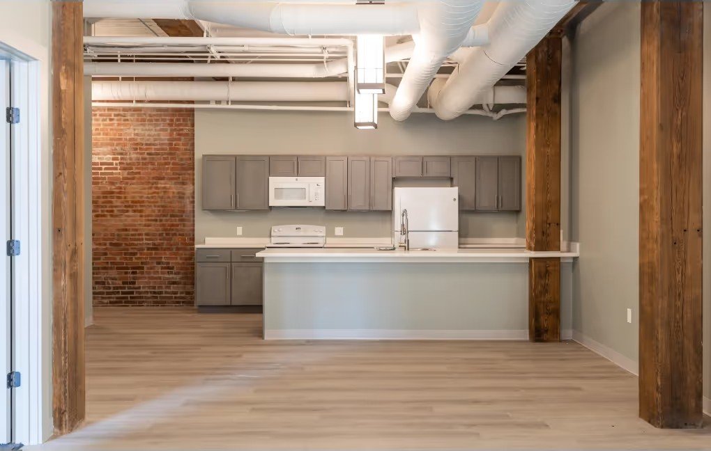 Loft unit kitchen with island and exposed mill timber