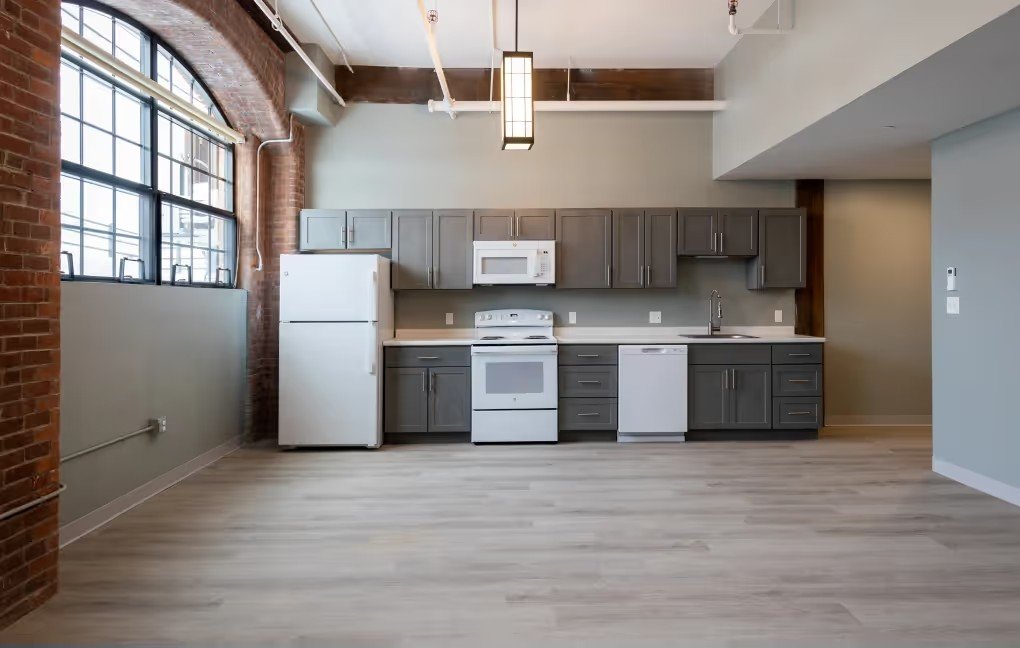 Open living and kitchen area in a converted mill unit