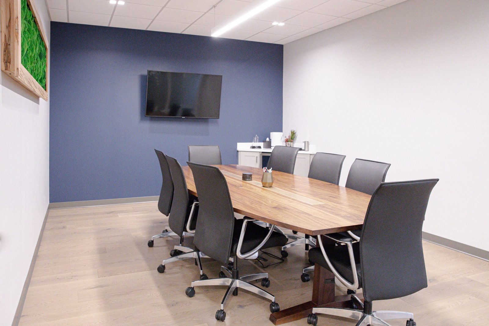 Conference room with live-edge table and display